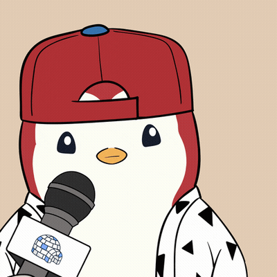 A Penguin Is Wearing A Red Hat And Holding A Microphone With A Globe On It GIF