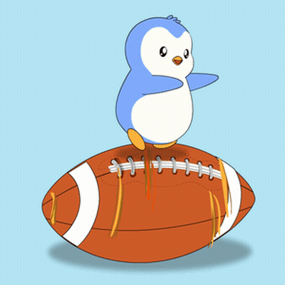 A Penguin Sitting On Top Of A Football GIF