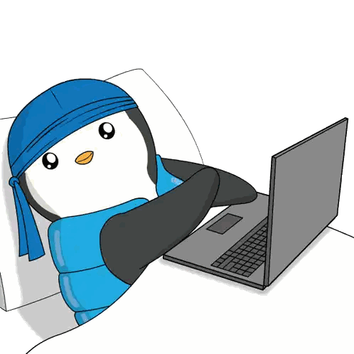 A Penguin Wearing A Blue Bandana Is Laying In Bed Using A Laptop Sticker