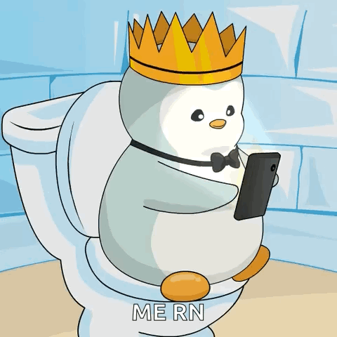 A Penguin Wearing A Crown Is Sitting On A Toilet Looking At His Phone GIF