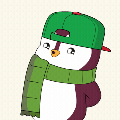 A Penguin Wearing A Green Hat And A Green Scarf GIF