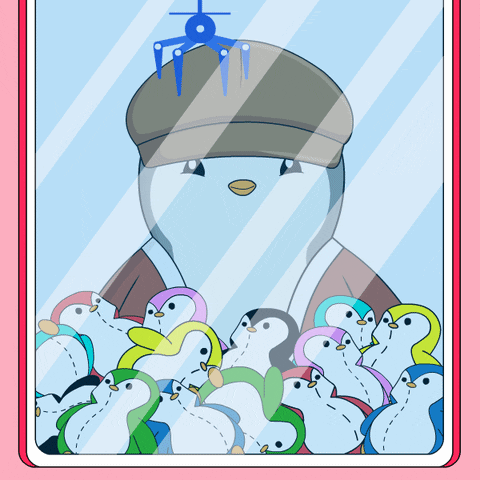 A Penguin Wearing A Hat Is Surrounded By Colorful Stuffed Penguins GIF