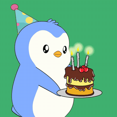 A Penguin Wearing A Party Hat Blows Out Candles On A Cake GIF