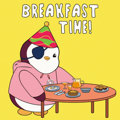 A Penguin Wearing A Party Hat Is Sitting At A Table With Food And The Words Breakfast Time GIF