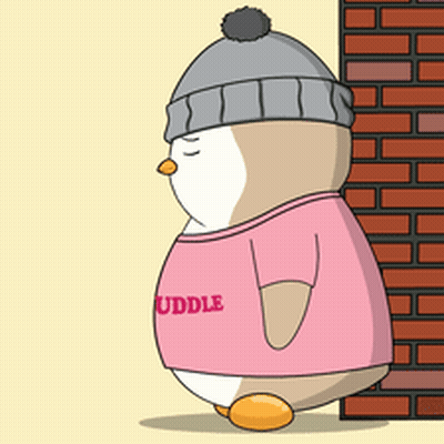 A Penguin Wearing A Pink Shirt That Says " Cuddle " Is Standing In Front Of A Brick Wall GIF