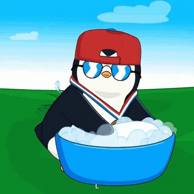 A Penguin Wearing A Red Hat And Sunglasses Is Holding A Blue Bowl Of Foam GIF
