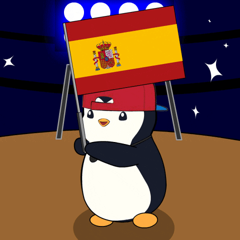 A Penguin Wearing A Red Hat Holds A Spanish Flag Above Its Head GIF