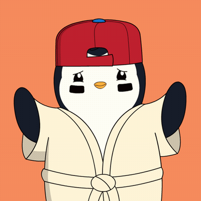 A Penguin Wearing A Robe And A Red Hat GIF