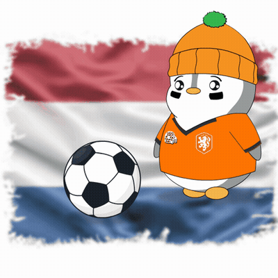 A Penguin Wearing An Orange Shirt With A Lion On It Is Standing Next To A Soccer Ball GIF