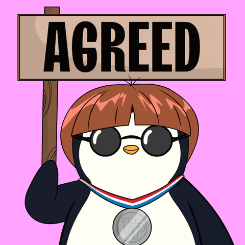 A Penguin Wearing Sunglasses Holds A Sign That Says Agreed GIF