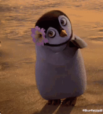 Penguin With Flower Walking On Beach GIF