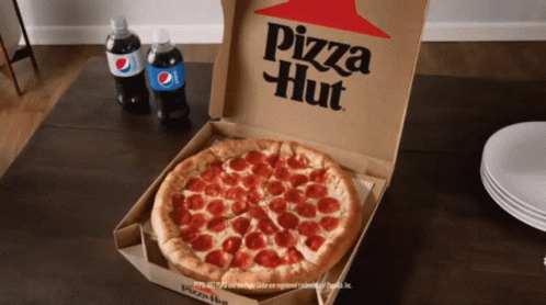 A Pepperoni Pizza In A Pizza Hut Box On A Table GIF