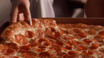 A Pepperoni Pizza With Cheese And Pepperoni Slices GIF