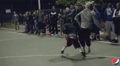 A Pepsi Logo Can Be Seen In The Corner Of This Basketball Court GIF