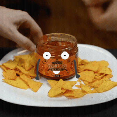 A Person Dipping Tortilla Chips Into A Jar Of Frontiera Sauce GIF