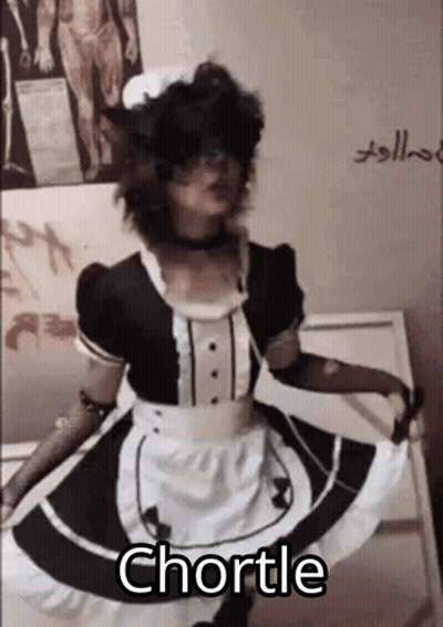 A Person Dressed As A Maid Is Dancing In Front Of A Wall . GIF