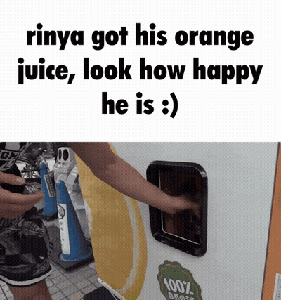 A Person Getting An Orange Juice From A Machine That Says 100 % On It GIF