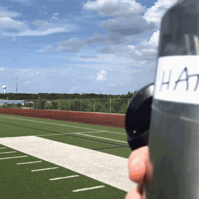 A Person Holding A Bottle With A Label That Says Hat On It GIF