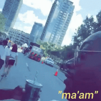 A Person Holding A Cup With A Straw And The Words " Ma 'Am " On The Bottom Right GIF