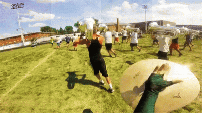 A Person Holding A Cymbal That Says T On It GIF