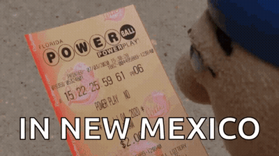 A Person Holding A Florida Powerball Ticket With The Words In New Mexico Below It GIF