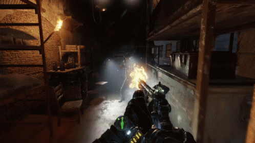 A Person Holding A Gun In A Dark Room With A Green Arrow Pointing To The Left GIF