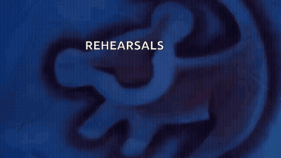 a person holding a gun with rehearsals written on it