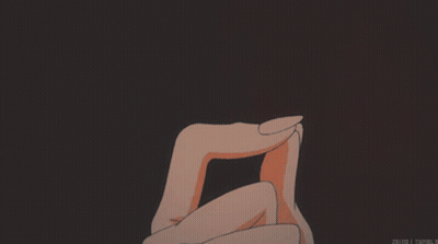 A Person Holding A Heart In Their Hands With A Dark Background GIF