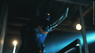 A Person Holding A Hockey Stick With The Letters Tm On The Bottom GIF
