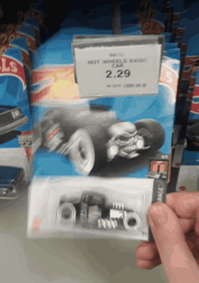 A Person Holding A Hot Wheels Basic Car For 2.29 GIF