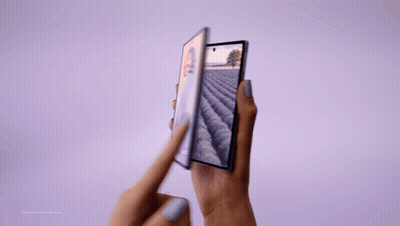 A Person Holding A Phone With A Field On The Screen GIF