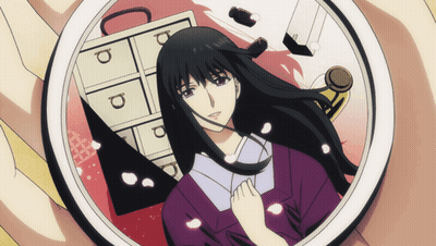 A Person Holding A Picture Of A Woman With The Letter P On The Drawers GIF