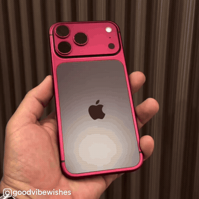a person holding a red iphone with the words goodvibewishes written on the bottom
