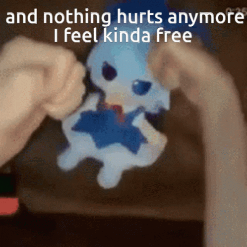 A Person Holding A Stuffed Animal With The Words " And Nothing Hurts Anymore I Feel Kinda Free " GIF