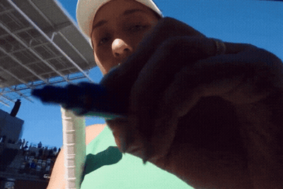 A Person Holding A Tennis Racquet With A Rubber Grip On It GIF