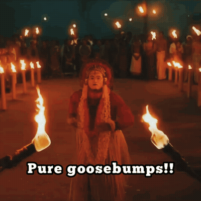 A Person Holding A Torch With The Words Pure Goosebumps Written Below Them GIF