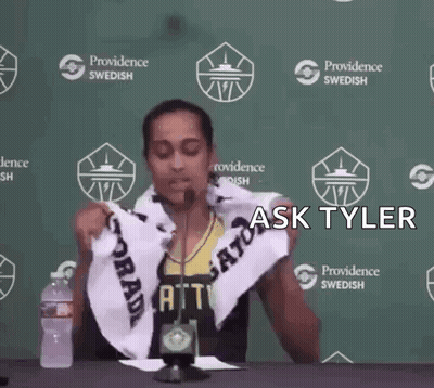 A Person Holding A Towel In Front Of A Providence Swedish Banner GIF