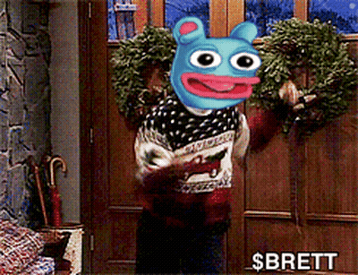 A Person Holding A Wreath In Front Of A Door With The Name Brett On The Bottom GIF