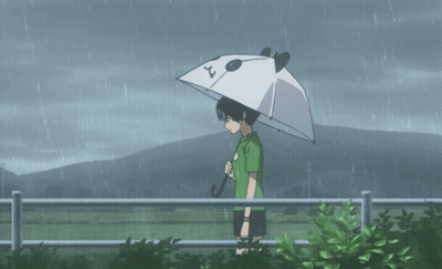 A Person Holding An Umbrella With The Number 2 On The Top GIF