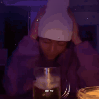 A Person Holding Their Head In Front Of A Glass That Says No No On It GIF