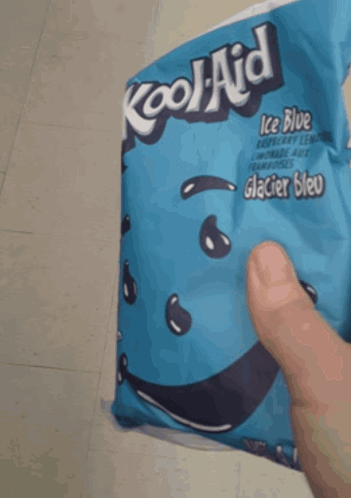 A Person Holds A Bag Of Kool Aid Ice Blue Raspberry Lemonade GIF