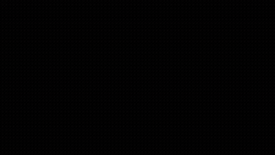 A Person In A Black Costume Is Sitting In Front Of A Computer . GIF