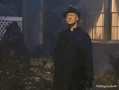 A Person In A Black Glove Is Holding A Small White Bottle With A Cross On It GIF