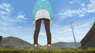 A Person In A Blue Hoodie And Brown Pants Standing In The Grass GIF