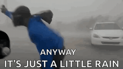 A Person In A Blue Jacket Is Jumping In The Air With The Words Anyway It 'S Just A Little Rain Written Below Them GIF
