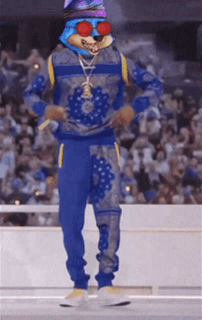 A Person In A Blue Outfit With A Rabbit Head On Their Head GIF