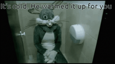 A Person In A Bugs Bunny Costume Is Sitting On A Toilet With The Caption It 'S Cold He Warmed It Up For You GIF