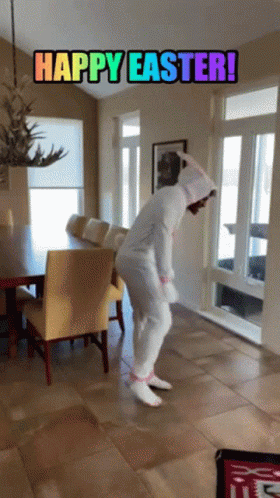 A Person In A Bunny Costume Is Dancing In A Living Room With The Words Happy Easter Written Above Them GIF