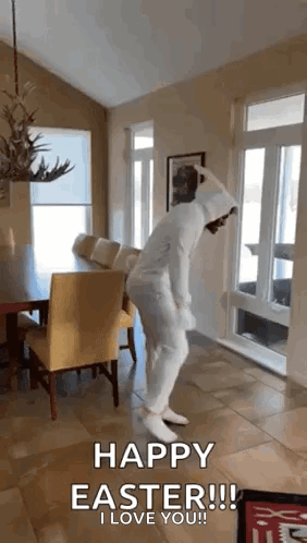 A Person In A Bunny Costume Is Jumping In The Air In A Living Room . GIF