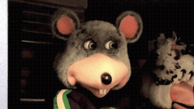 A Person In A Chuck E Cheese Mouse Costume GIF